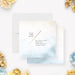 Elegant save-the-date card featuring a cream and blue watercolor wash background, a diagonal gold line, and customizable event details.-front-back