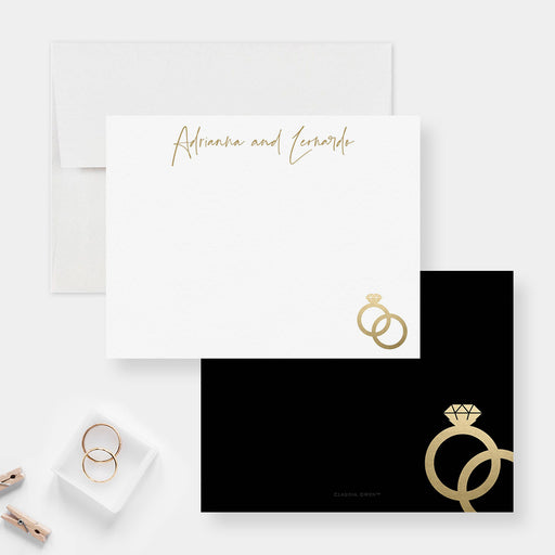 Personalized wedding ring note card front and back, with printed gold ring illustrations, script names and a black back.