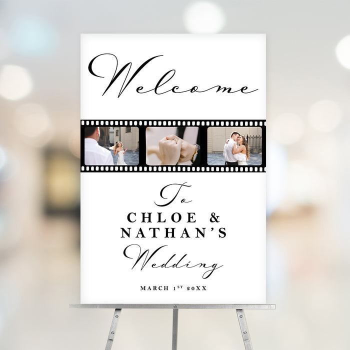 wedding welcome sign with black script lettering, photo filmstrip featuring couple images, custom names, wedding date, and easel display.