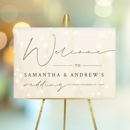 Wedding welcome sign with soft glowing string lights, customizable with names and wedding details.