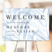 Dusty blue leaf wedding welcome sign with personalized names and date for ceremony or reception decor.
