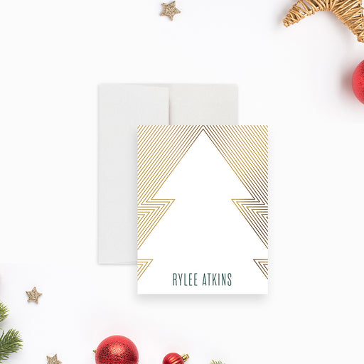 Personalized note card with a white Christmas tree and gold-colored line pattern, beside a dark green back with a small gold-colored tree.