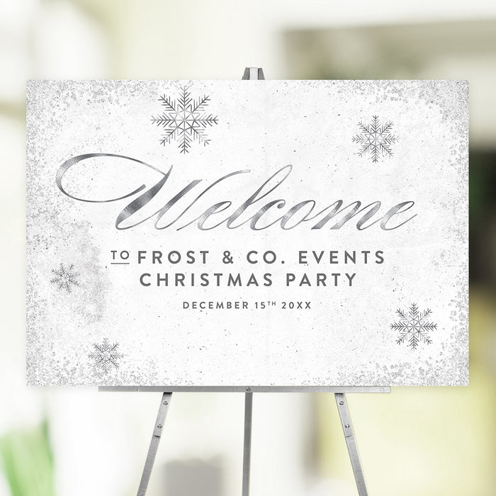White and silver Christmas welcome sign with a snowflake design used as elegant holiday event entrance signage