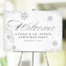 White and silver Christmas welcome sign with a snowflake design used as elegant holiday event entrance signage