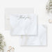 White thank you cards with dark script lettering over a printed folded fabric design on the front and a matching white fabric print reverse.