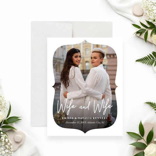 wife and wife photo wedding announcement card with custom couple photo, elegant white border, script lettering, and personalized details-front