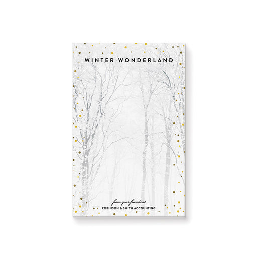 Custom winter wonderland notepad with snow-covered forest design, personalized stationery gift with company name, seasonal party favor, or holiday desk accessory.
