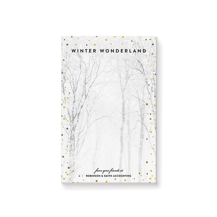Notepad cover with winter wonderland design and tree silhouettes on a white background