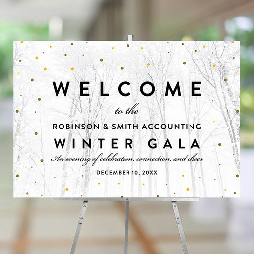 Elegant winter gala welcome sign with snowy forest background and gold confetti accents, displayed on an easel – customizable with event details.