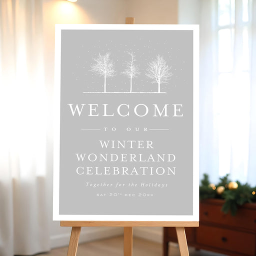 Winter wonderland welcome sign featuring snowy trees on a soft gray background, perfect entrance sign for holiday parties and winter celebrations.