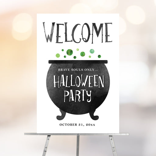 Halloween party welcome sign with a black cauldron and green potion bubbles, a spooky witch-themed party decoration.