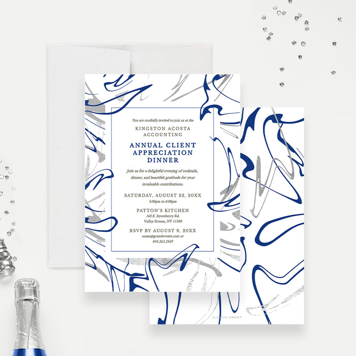 a white and blue wedding suite with a bottle of champagne