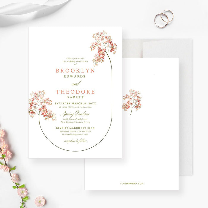 Elegant spring wedding invite featuring soft pink flowers