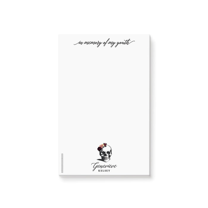 A white notepad with an illustration of a skull wearing a flower crown, and text that reads 'In Memory of my Youth'. The notepad is customizable with a name and has a subtitle 'Death to my 20s Birthday Party Favor Pad'.