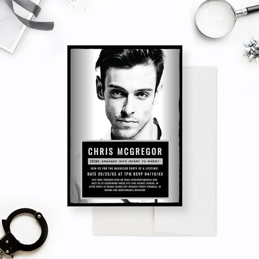 Mugshot style bachelor party invitation with a large black and white photo and dark information panel.