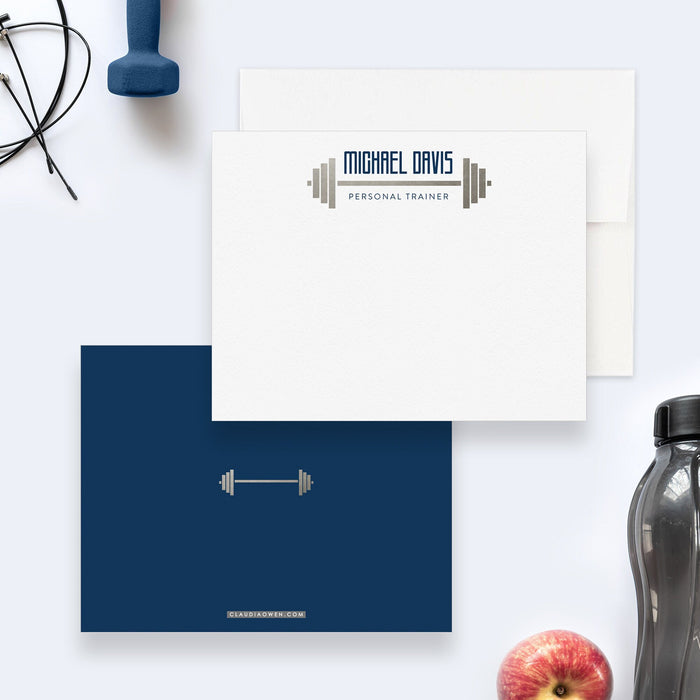 Fitness trainer note cards with a barbell and personalized name on the white front, and a small gray barbell on a navy blue back.