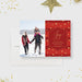 Red holiday photo card featuring a modern Joy design, gold confetti accents, and space for a family photo